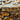 Close-up of Summer Tan Thin Veneer Stone showing warm tan and light gray natural granite colors