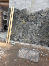 Black Sparkle Thin Veneer Stone installed on a modern cabin surround