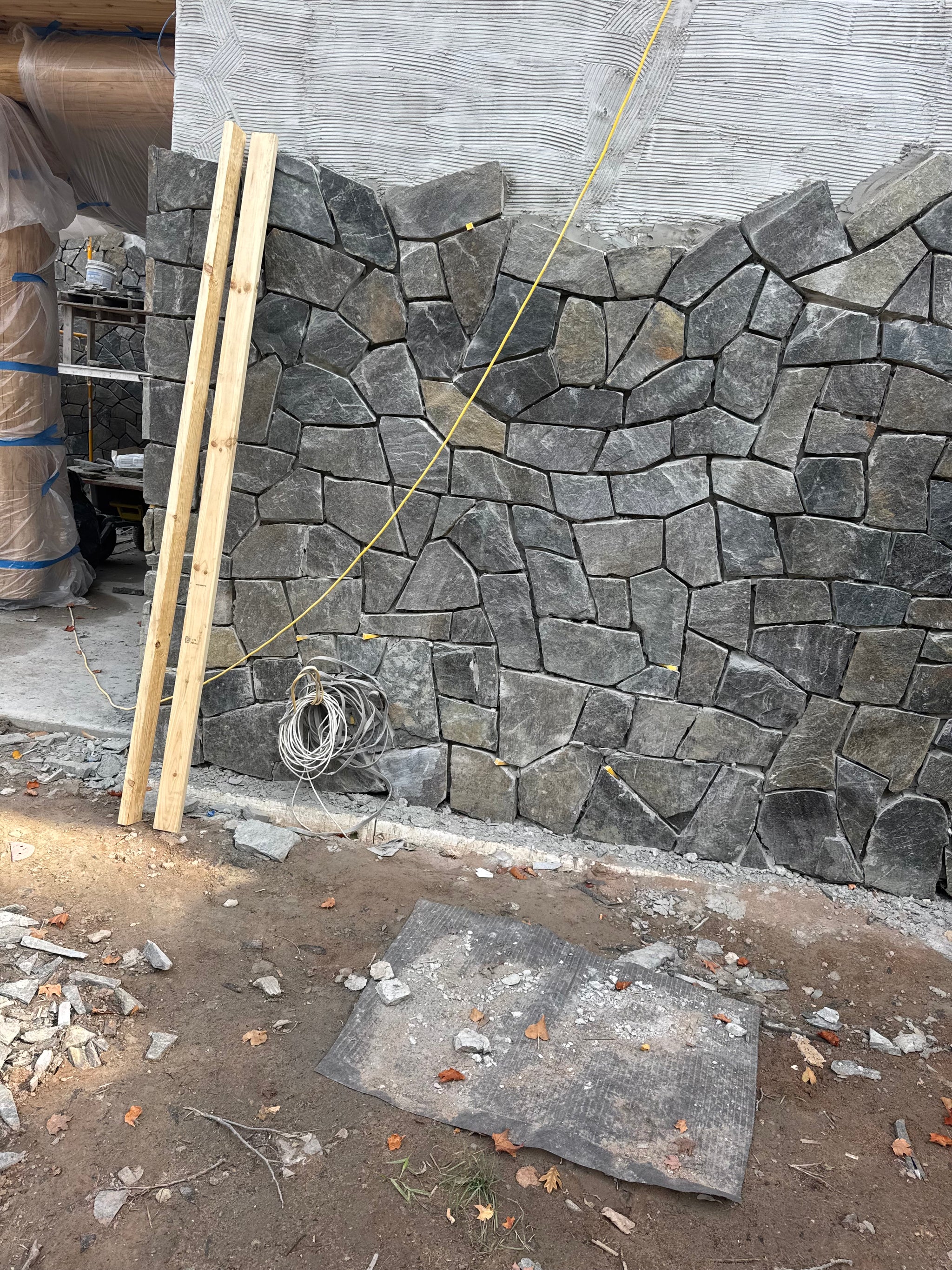 Black Sparkle Thin Veneer Stone installed on a modern cabin surround