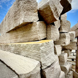 Close-up of Brandy Rubble Edging Stone showing its natural gray color, soft tan variations, and rugged surface.