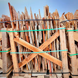 Stack of wooden planks with a blue sky background