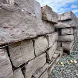 Close-up of Rock Island Lilac edging stone showing natural gray, blue, and lilac color variations.