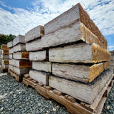 Side view of palletized Rock Island Lilac landscape steps with rust-gold faces, gray tops, and 5–6 inch thickness