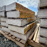 Rock Island Lilac 5–6 inch thick stone steps stacked on a wooden pallet, rust face and gray ends visible
