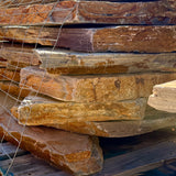 Approximately 3-inch-thick Summer Tan natural granite flagstone.