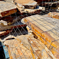 Large-format Summer Tan flagstone pieces ranging from approximately 18 inches to 3 feet.