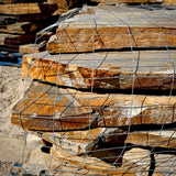 Stack of large Summer Tan granite flagstones ready for patio installation.