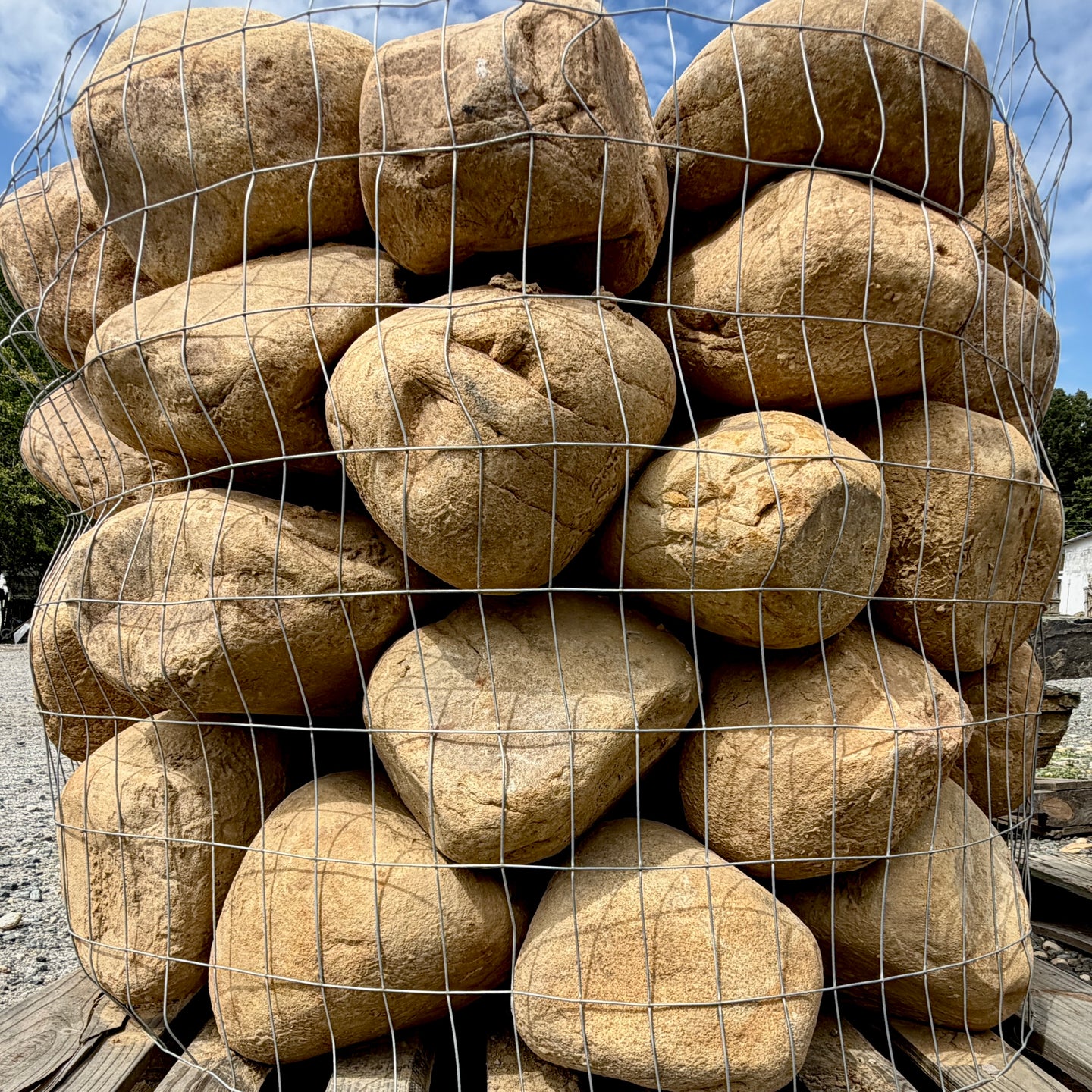 Brown Mountain River Rounds used for erosion control on a landscaped slope