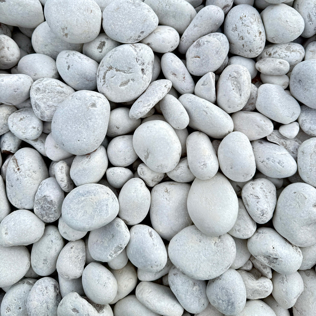 Decorative White Mexican Beach Pebbles for use around a landscape water feature